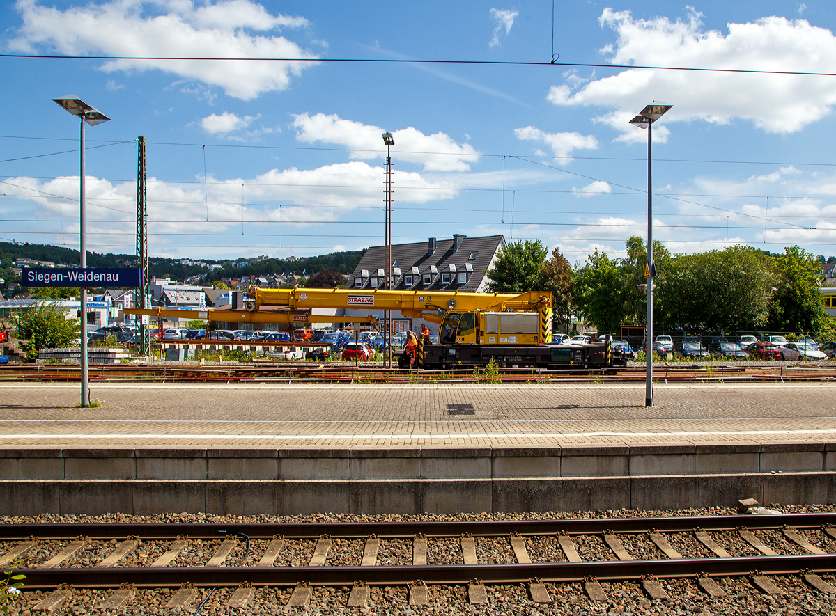 Der 50 t GOTTWALD Gleisbauschienenkran GS 50.09 T, Schweres Nebenfahrzeug Nr. 99 50 9219 028-9 CH-BRS „Werner“ der BMTI Rail Service GmbH (Servicebetrieb der STRABAG SE), ex VTmaas 99 85 92 19 028-9 VANOMAG AG Kran VIII, ex VTmaas 80 85 94 81 407-7, ist am 30.07.2021 im Bahnhof Siegen-Weidenau im Einsatz.

Der Kran wurde 2002 von Gottwald in Düsseldorf gebaut.

TECHNISCHE DATEN:
Spurweite: 1.435 mm
Anzahl der Achsen: 6 (in 2 Drehgestellen)
Länger über Puffer: 12.000 mm (ohne Kranausleger)
Drehzapfenabstand: 7.000 mm
Achsabstand im Drehgestell : 1.500 mm
Raddurchmesser: 920 mm (neu) 
Breite in Transportstellung: 3.100 mm
Höhe in Transportstellung: 4.200 mm
Eigengewicht: 116 t in Transportstellung (Gegengewicht abgelegt)
Traglast:  50.000 kg bei 3,0 m Ausladung vor Puffer 
  18.300 kg bei 12,5 m Ausladung vor Puffer
Kleinster befahrbarer Radius: 90 m 
max. Geschwindigkeit im Zugverband: 100 km/h
max. Geschwindigkeit im Eigenantrieb: 25 km/h
Bremse: KE-GP mZ (D)