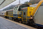 Die SNCB/NMBS HLD 7764  Toledo  leistet am 23 November 2013, einem IC nach Ostende, vom Bahnhof Lüttch-Guillemins, Schubhilfe.