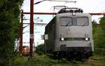 RailAdv 139 558 wird gerade aufger�stet, im Hintergrund die SRP MY 1148.