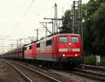 151 077-5 und 106-1 mit dem leeren Erzzug bei der Durchfahrt in Hamburg-Harburg.