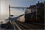 Ich hoffe, das Bild wirkt nicht zu dunkel: eine Re 460 bei der Durchfahrt mit ihrem IR in St-Saphorin  am 31.