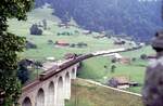 BLS Ae 8/8 mit einem langen Güterzug auf dem Kanderviadukt am 28.07.1980.