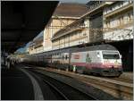 Die Coop Tischtuch Re 460 063-9 mit einem IR in Lausanne.