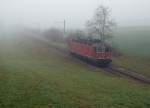 SBB: Trotz selbem E-Loktyp und gleicher Fotostelle sind die beiden Aufnahmen wegen der Wetterlage sehr unterschiedlich ausgefallen.
