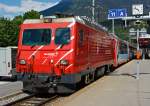 Die MGB HGe 4/4 II - 3   Dom  (ex BVZ 3   Dom ) steht am 28.05.2012 mit Glacier Express im Bahnhof (-vorplatz) Brig.