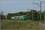 Der BAM Regionalzug 110 mit dem führenden Bt 52 und dem schiebenden Be 4/4 12 zwischen Chigny und Vufflens le Château.