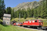 RhB Ge 4/4 I U Nr.601 und Ge 4/4 III Nr.646 mit Werbung BÜGA in Spinas beim Albula-Tunnel Südseite am 19.08.2009.