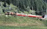 RhB Ge 6/6 I Nr.414 mit Pullman Salonwagen in Bergün im August 1990.