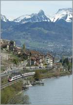 Auch ohne das B�ume weichen m�ssen, bieten die Berge und H�gel im Lavaux ein interessante Sicht auf das Bahngeschehen der Gegend: SBB ETR 610 bei St-Saphorin.